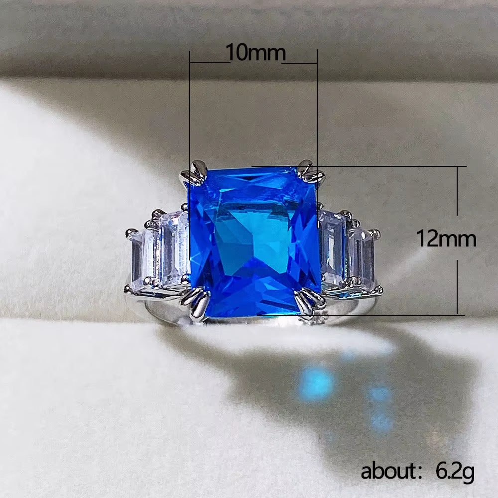 F1165 Women'S 925 Sterling Silver Ring with Blue Topaz Emerald-Cut Prong Setting Geometric Engagement Jewelry