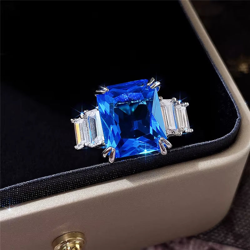 F1165 Women'S 925 Sterling Silver Ring with Blue Topaz Emerald-Cut Prong Setting Geometric Engagement Jewelry